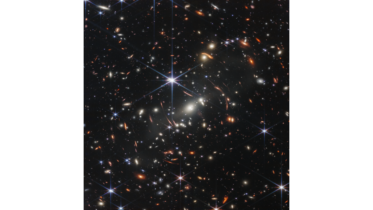 Thousands of galaxies flood this near-infrared image of galaxy cluster SMACS 0723. High-resolution imaging from NASA’s James Webb Space Telescope combined with a natural effect known as gravitational lensing made this finely detailed image possible.