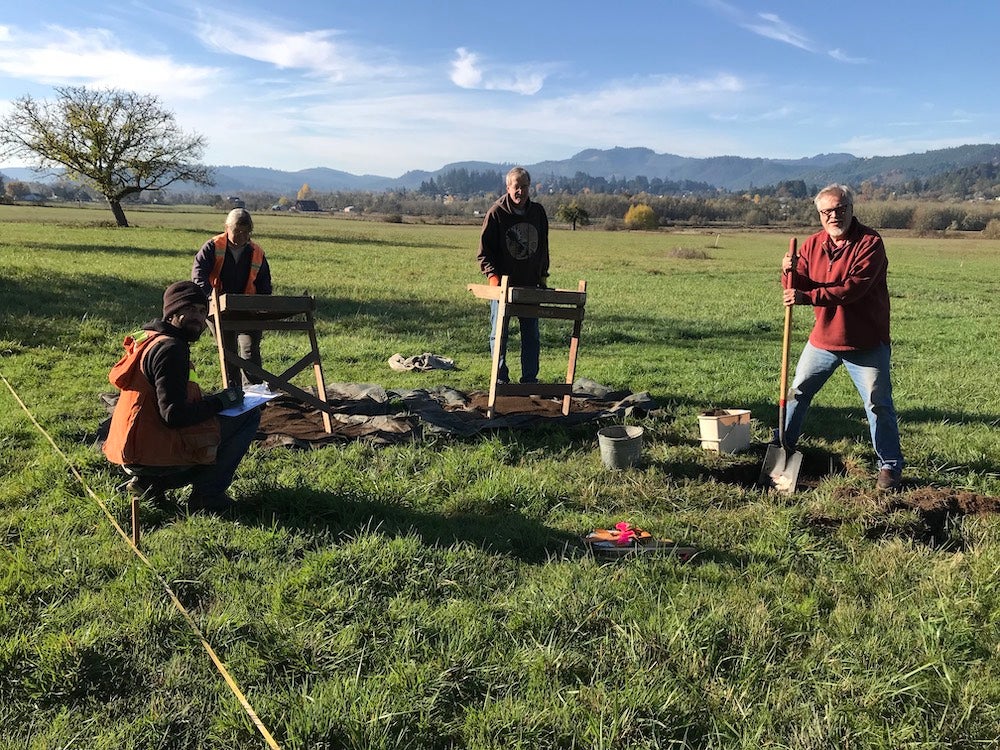 Crew excavating in field west of the old house.jpg