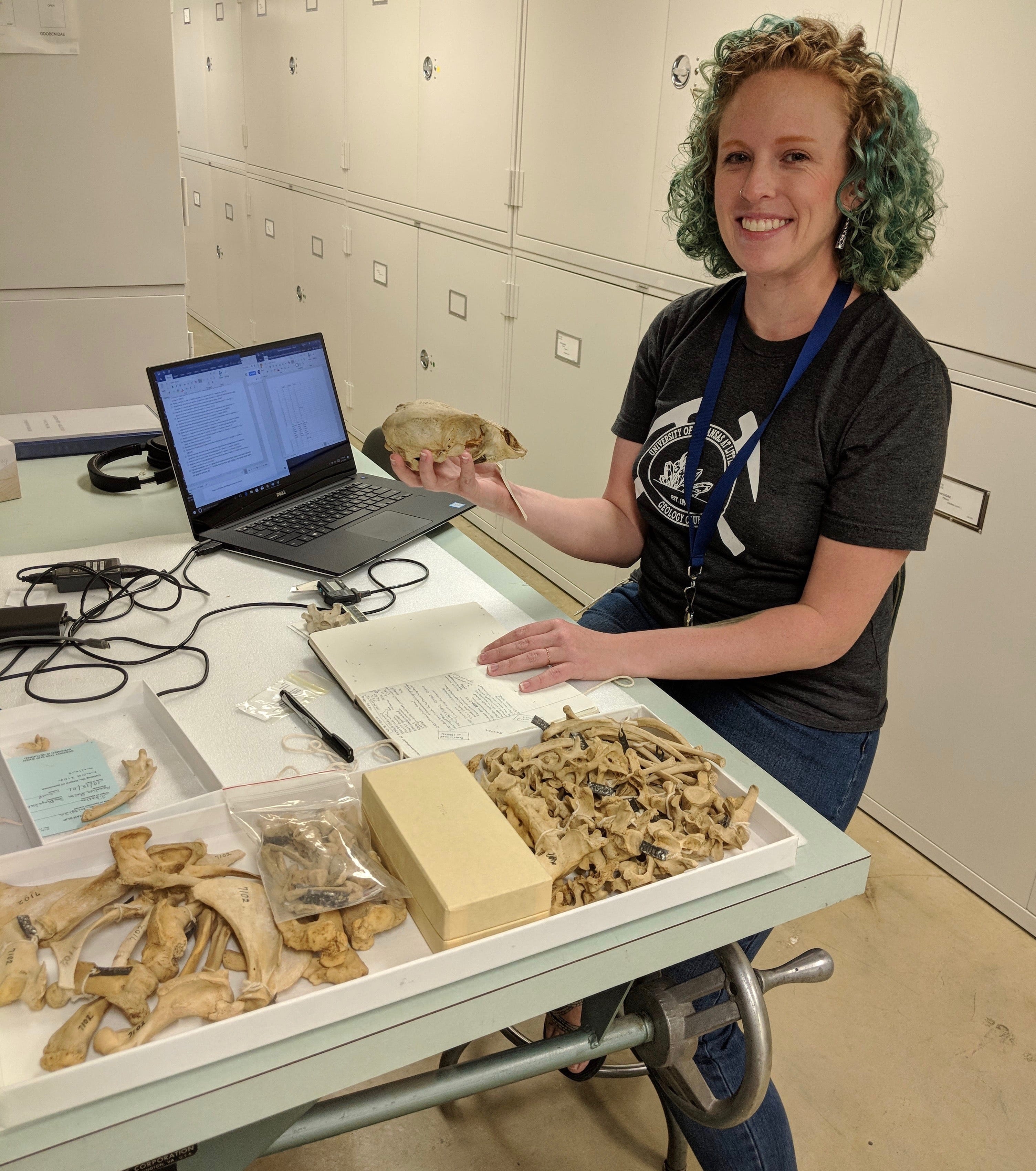 Kellum demonstrating some fossils