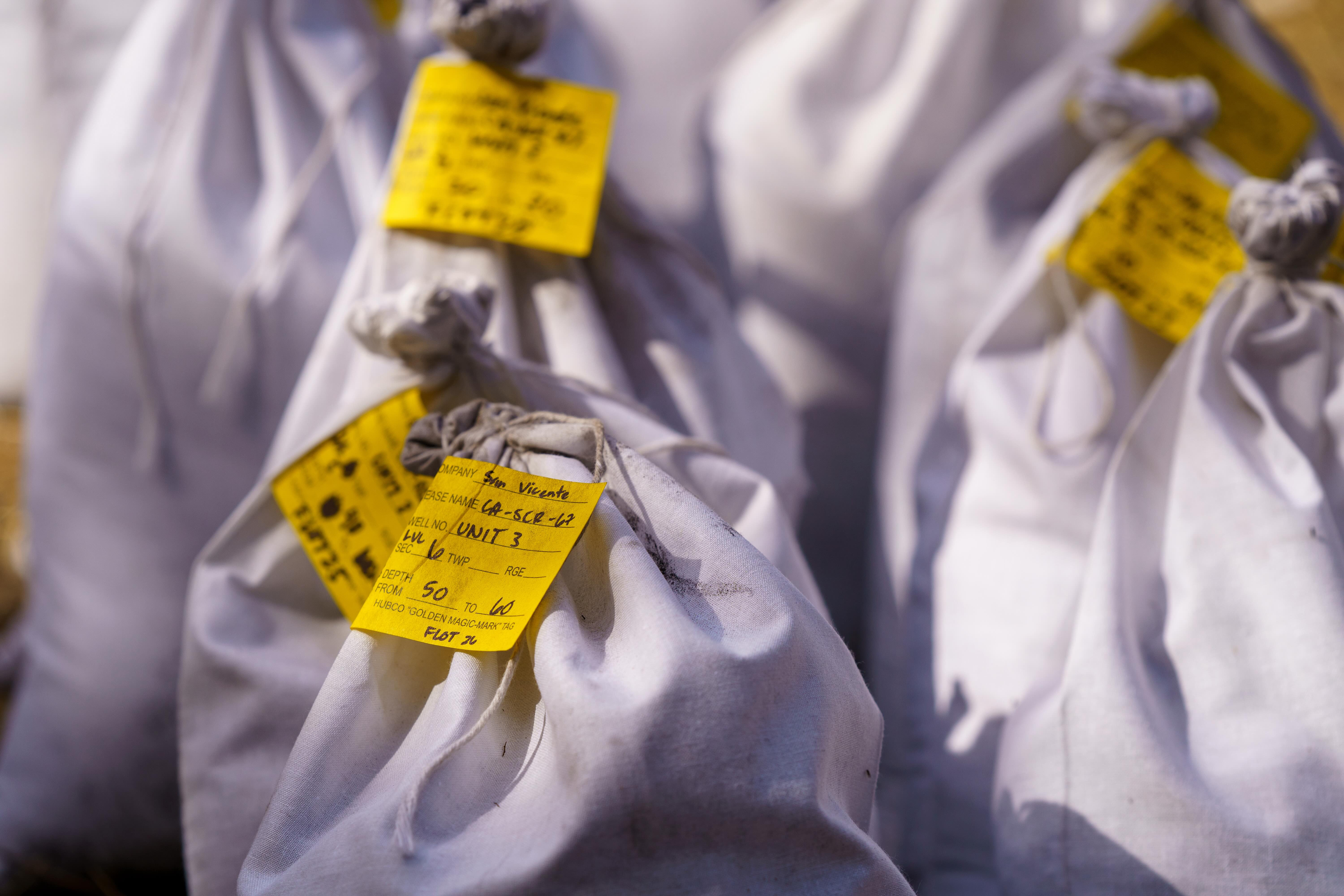 bags of soil samples labeled for floating