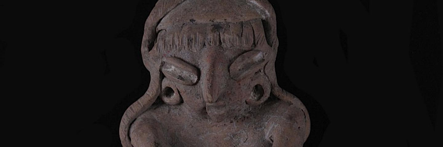 Female Human Figurine Kneeling to Grind Maize in Metate (front). Crafted to be three dimensional, this figurine is fully modeled front and rear. Buff earthenware, unpolished, traces of white paint.