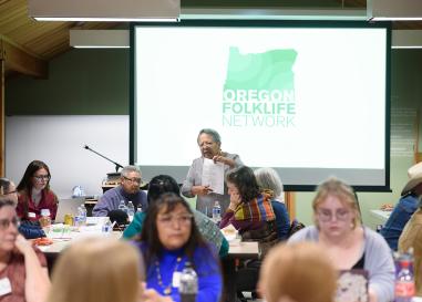 Celeste Whitewolf presents at OFN event. Get Involved page banner.