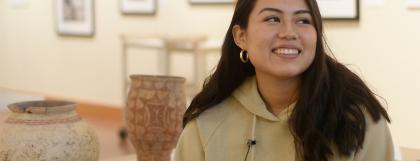 Student with Ban Chiang pottery collection