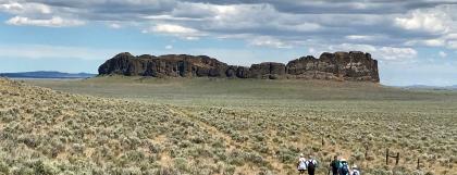 Excursion participants hiking near Fort Rock Cave