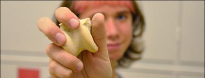 Student holding a bone
