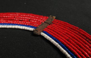 Detail of red beaded collar