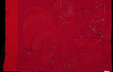 Mola with anthropomorphic rooster and beer bottle, cups, and flag. (interior)