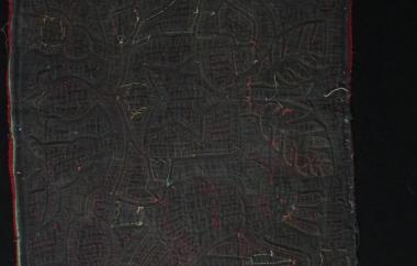 Reverse of mola with a bird and a deer on black cloth