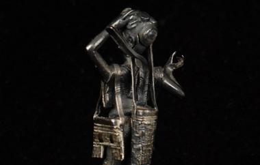 Cast metal figurines from the early 20th century, back side