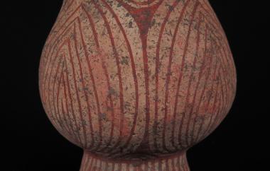 Pedestaled vessel with a concentric vertical design in red