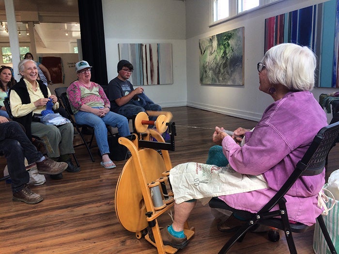 Demonstration of spinning wool